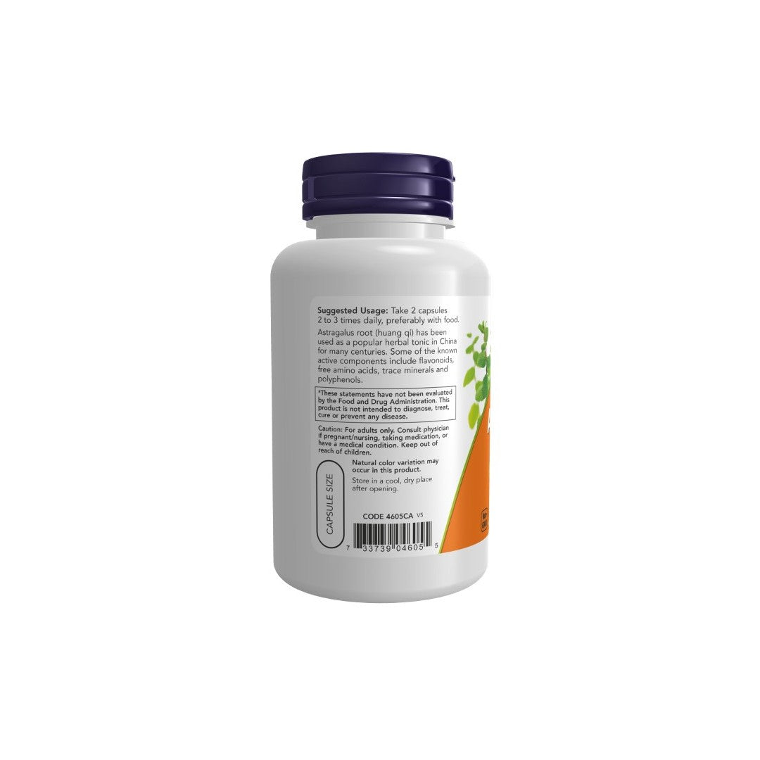 The back view of a white supplement bottle with a dark blue cap shows the label containing usage instructions and ingredients for immune system support. Some text on the label is partially visible, including "Take 2 capsules" and "CODE 4665A." The product is Astragalus 500 mg in 100 Veg Capsules, by Now Foods.