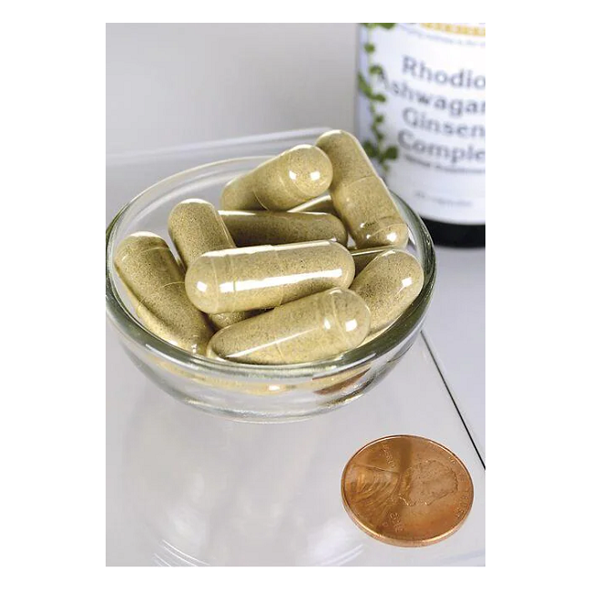 A small glass bowl holds several large Adaptogenic Complex capsules from Swanson, next to a penny and a nearby supplement bottle labeled "Adaptogenic Complex Rhodiola, Ashwagandha & Ginseng - 60 capsules.