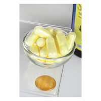 Thumbnail for A small glass bowl with yellow capsules is on a scale for metabolic support, with a coin for size reference. In the background, a Swanson Alpha Lipoic Acid - 600 mg bottle is partly visible.