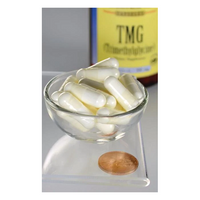 Thumbnail for A glass bowl filled with white capsules sits next to a copper coin, with a Swanson TMG Trimethylglycine bottle suggesting its role in promoting liver health.