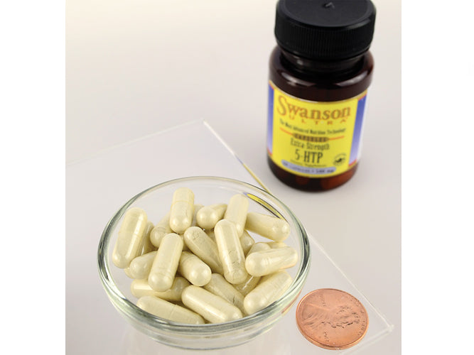 Une bouteille de Swanson 5-HTP Mood and Stress Support - 50 mg 60 capsules à côté d'un penny.