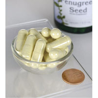 Miniature pour Un flacon de Swanson Fenugrec - 610 mg 90 gélules se trouve à côté d'un bol de gélules.
