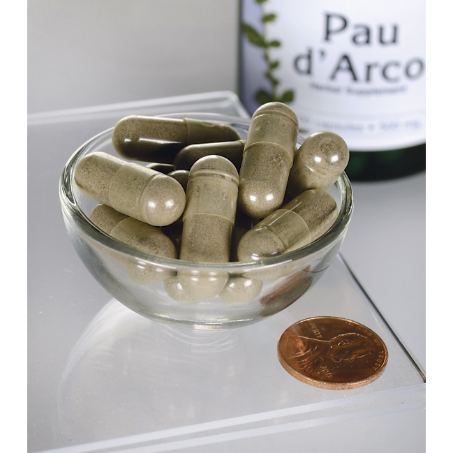 Swanson's Pau d'Arco - 500 mg 100 capsules, derived from the Pau d'Arco tree's bark found in tropical forests, are displayed in a bowl alongside a bottle.