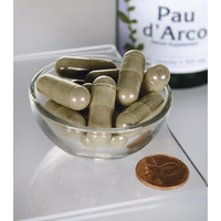 Thumbnail for Swanson's Pau d'Arco - 500 mg 100 capsules, derived from the Pau d'Arco tree's bark found in tropical forests, are displayed in a bowl alongside a bottle.