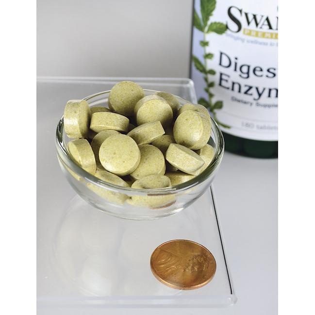 Un flacon d'enzymes digestives Swanson - 180 comprimés et un penny dans un bol en verre.
