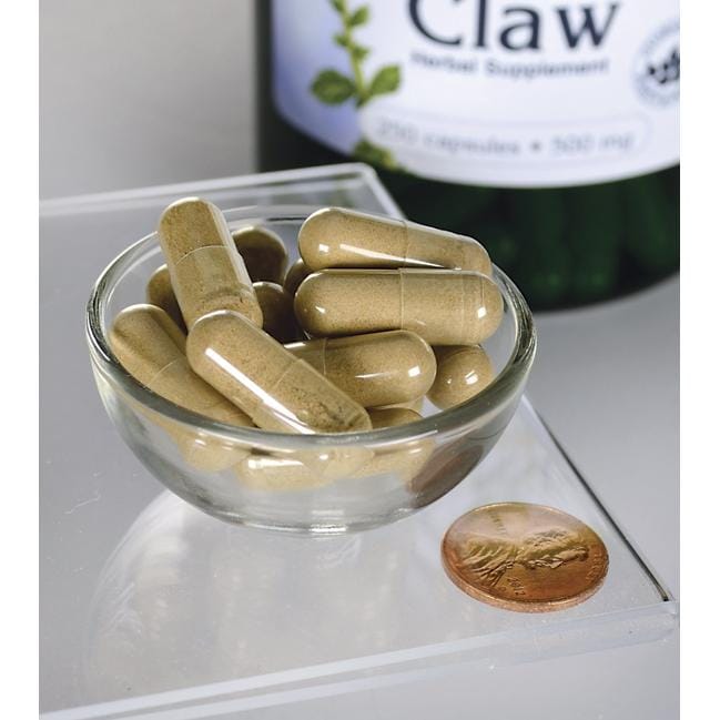 Un bol de Swanson's Cats Claw - 500 mg 250 gélules à côté d'une bouteille.