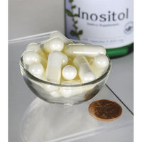 Vignette de Swanson Inositol - 650 mg 100 gélules dans un bol à côté d'une bouteille de Swanson Inositol.