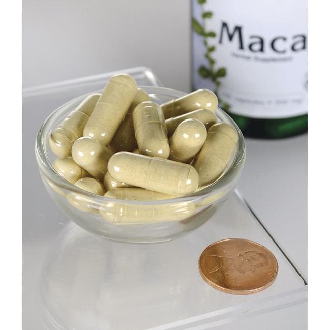 Swanson Maca - 500 mg 100 gélules dans un bol à côté d'une bouteille de Swanson Maca.