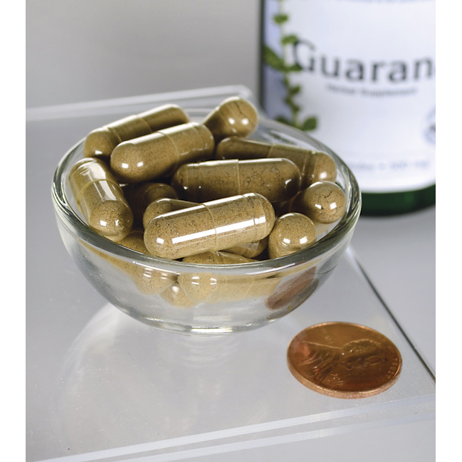 Swanson Guarana - 500 mg 100 gélules dans un bol à côté d'une bouteille.