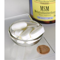 Vignette de Swanson's MSM - 1 500 mg 120 comprimés aux propriétés anti-inflammatoires dans un bol à côté d'un penny.