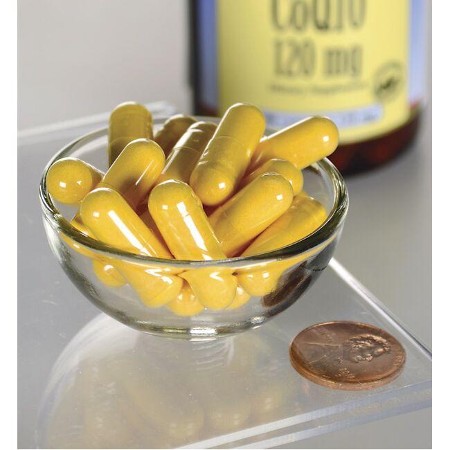 Swanson Coenzyme Q10 - 120 mg 100 gélules dans un bol en verre à côté d'une bouteille.