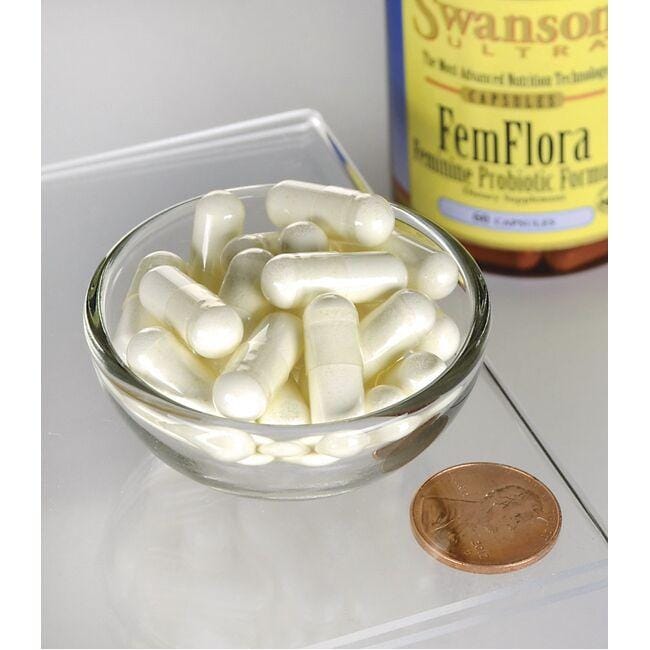 Une bouteille de FemFlora Probiotic for Women - 60 gélules de Swanson et un penny dans un bol.
