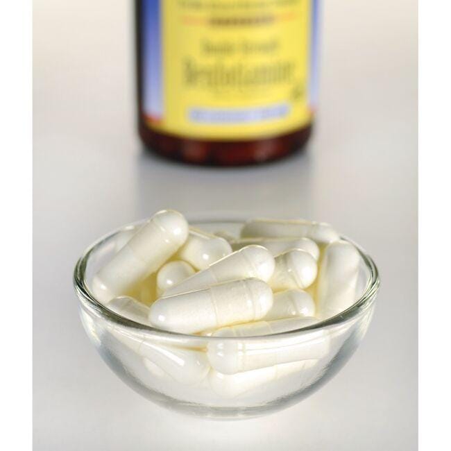 A bowl of Vitamin B-1 Benfotiamine - 160 mg 60 capsules by Swanson next to a bottle of vitamin D, potentially aiding in blood sugar levels and glucose metabolism.