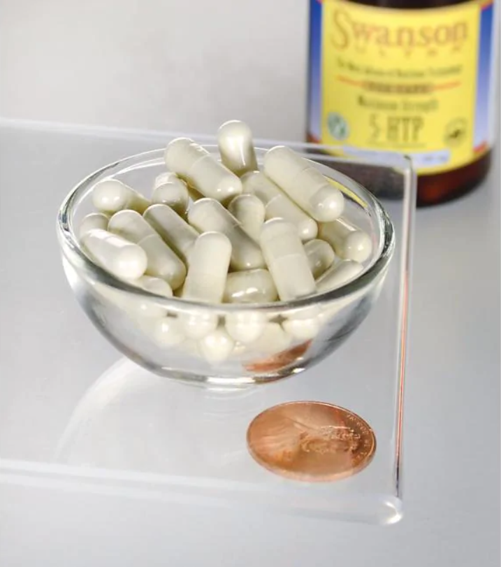 Un bol de Swanson 5-HTP Maximum Strength 200 mg 60 Capsules à côté d'un penny.