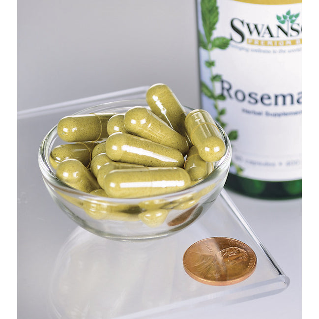 Un bol contenant une bouteille de Swanson Rosemary - 400 mg 90 capsules, une herbe riche en antioxydants, et un penny.