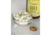 Vignette de Swanson DHEA - 100 mg 60 gélules dans un bol à côté d'un penny.